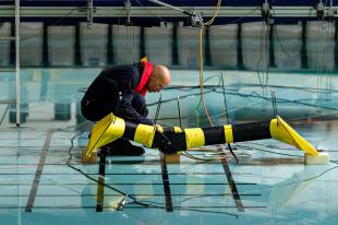 Mocean engineer inspects test model